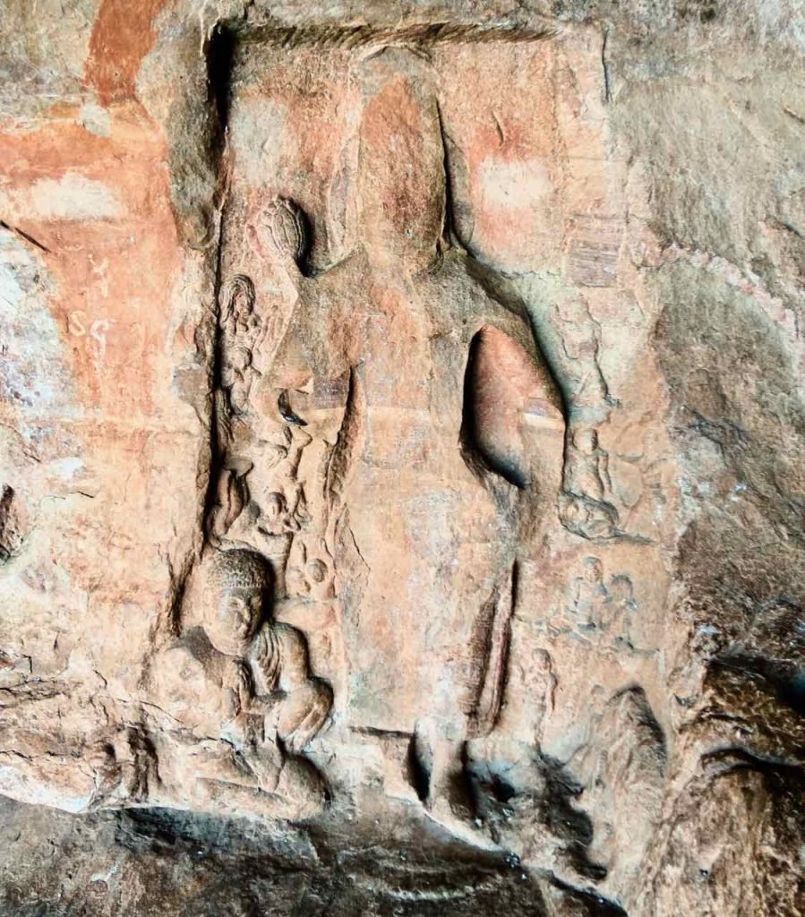 Remains of a Padmapani Avalokitesvara carving in the Buddhist natural cave, Badami, North Karnataka.